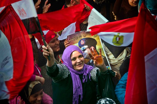 An Egyptian woman flashes Rabaa sign during the 3rd memory for the Egyptian revolution in Tahrir, Cairo, Egypt. Saturday, Jan 25, 2014. (Photo/Hamada Elrasam)